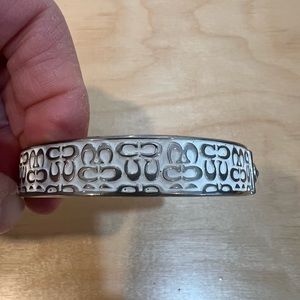 Coach silver/white bracelet. 1/2 inch thick bracelet. Like new, wore twice